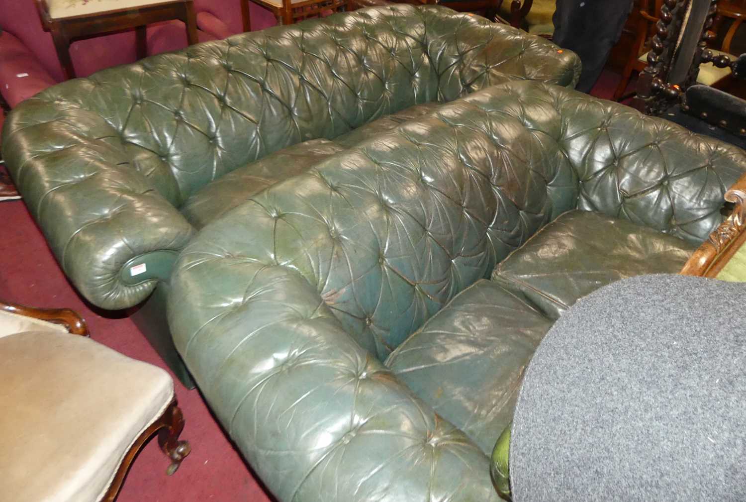 Lot 1340 - A green leather buttoned Chesterfield...
