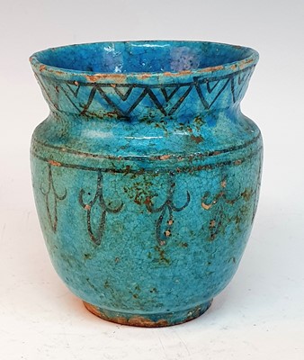 Lot 2424 - A Persian Kashan turquoise glazed earthenware...