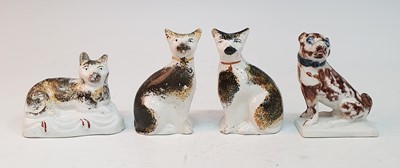 Lot 2077 - A pair of circa 1850 Staffordshire cats, each...