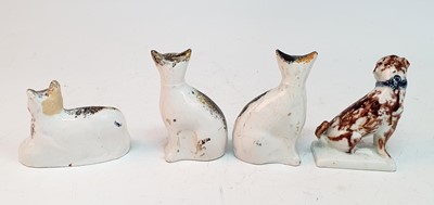 Lot 2077 - A pair of circa 1850 Staffordshire cats, each...