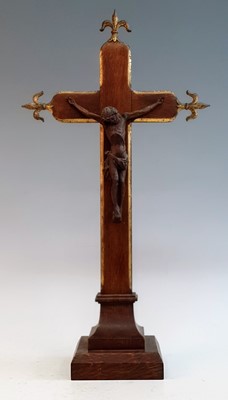 Lot 2343 - A Victorian parcel gilt carved oak crucifix,...