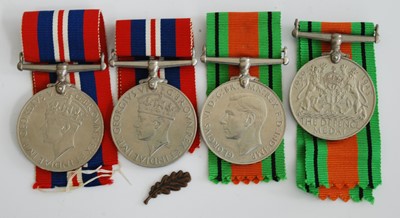 Lot 230 - A collection of four WW II medals to include...