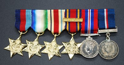Lot 114 - A group of six medals to include 1939-1945...