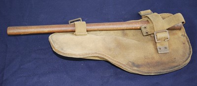 Lot 166 - A WW II entrenching tool, in webbing pouch.