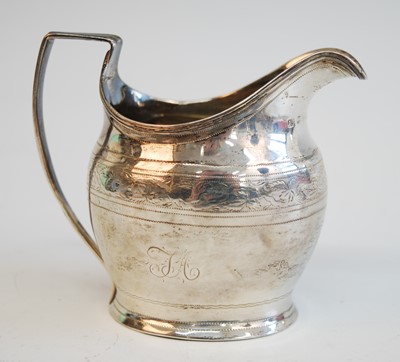 Lot 2133 - A George III cream jug, of helmet form with...