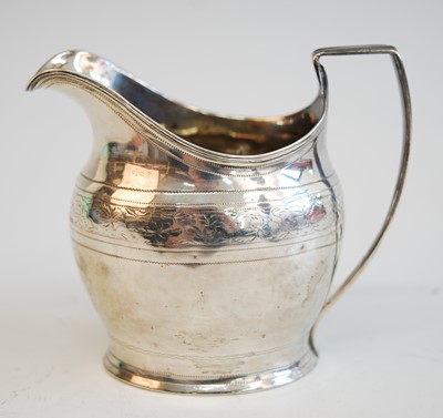 Lot 2133 - A George III cream jug, of helmet form with...