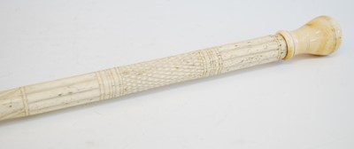 Lot 2350 - A 19th century narwhal tusk carved walking...