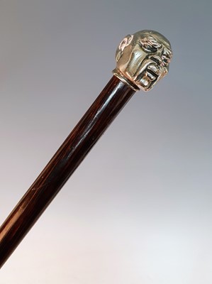 Lot 2362 - An early 20th century walking stick, the white...