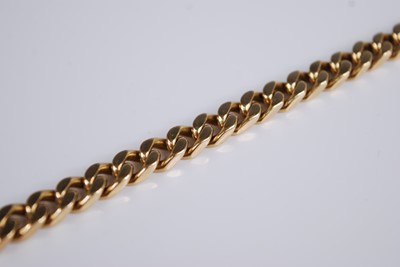 Lot 2228 - An 18ct gold flat curblink bracelet, stamped...