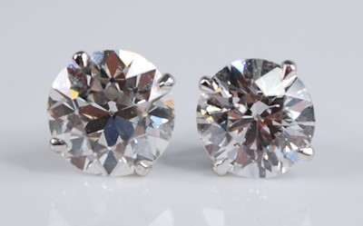 Lot 2190 - A pair of Edwardian platinum diamond set ear...