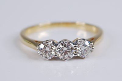 Lot 2236 - An 18ct yellow and white gold diamond three...