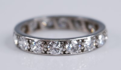 Lot 2238 - A white metal diamond full hoop eternity ring,...