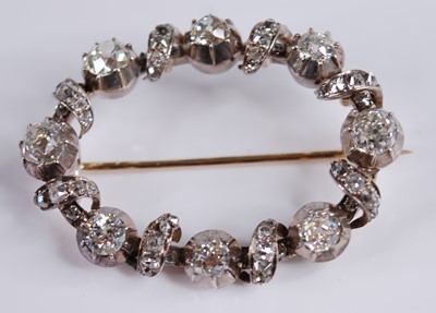 Lot 2244 - A white metal diamond oval openwork brooch,...