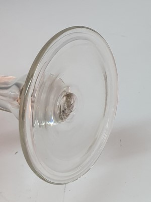 Lot 2106 - A large Georgian wine glass, the round funnel...