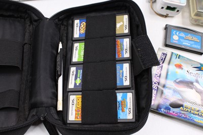 Lot 1144 - A collection of mixed video game consoles and...