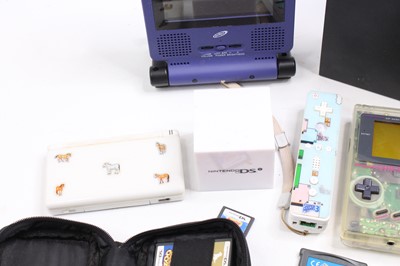 Lot 1144 - A collection of mixed video game consoles and...