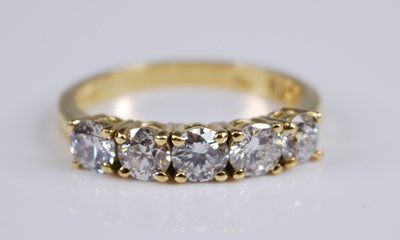 Lot 2257 - An 18ct yellow gold diamond five stone half...