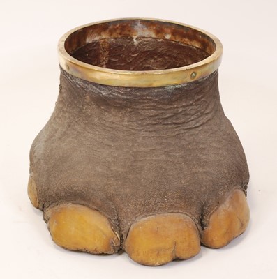 Lot 456 - A decorative elephant foot wastepaper bin,...