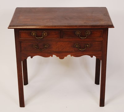 Lot 2542 - A George III mahogany and crossbanded lowboy,...