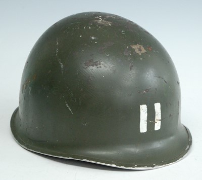 Lot 26 - A U.S. M1 steel helmet, marked II to the front,...