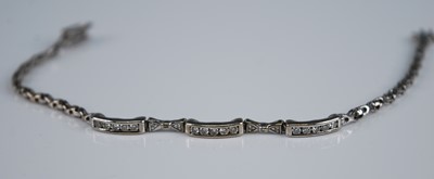 Lot 2262 - A white metal and diamond set spiga link...