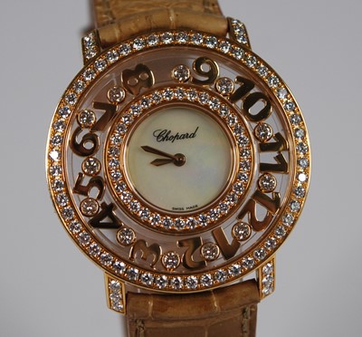 Lot 2422 - A lady's Chopard 18ct gold 'Happy Diamonds...