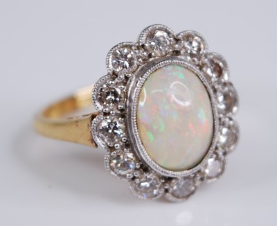 Lot 2264 - An 18ct gold and platinum, opal and diamond...