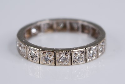 Lot 2271 - A white metal diamond set eternity ring,...