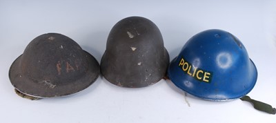 Lot 40 - A WW II Homefront steel helmet, crudely...