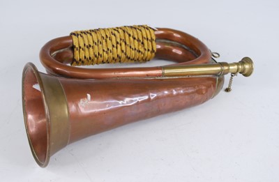 Lot 28 - An early 20th century copper and brass bugle,...