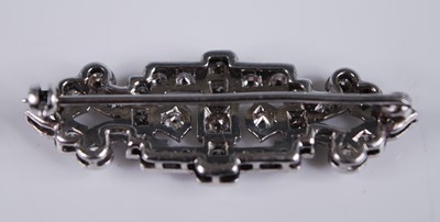 Lot 2193 - A white metal Art Deco diamond panel brooch,...