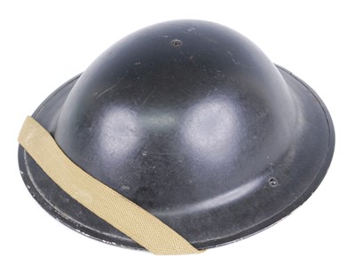 Lot 219 - A WW II British Army Mk II steel helmet, the...