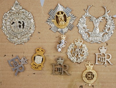 Lot 281 - A small collection of cap and collar badges,...