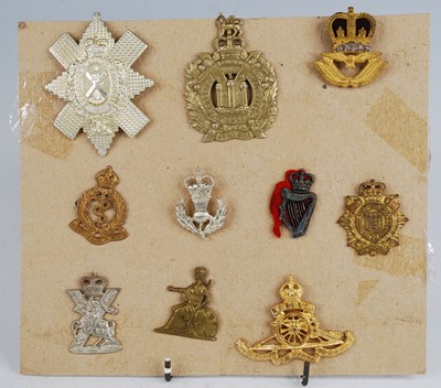 Lot 282 - A small collection of cap and collar badges,...