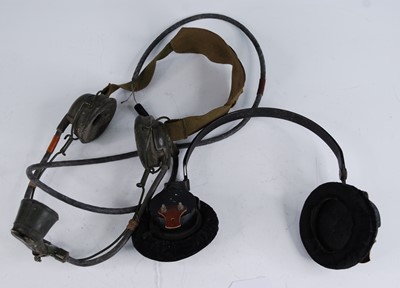 Lot 279 - A pair of military headphones, having a canvas...