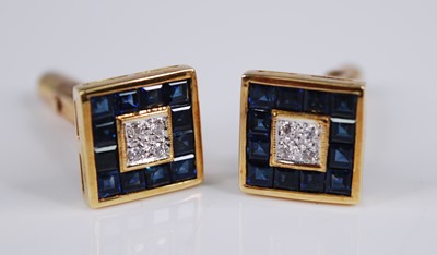 Lot 2215 - A pair of Far Eastern yellow metal, sapphire...