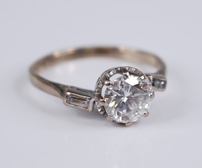 Lot 2294 - An 18ct gold diamond solitaire ring, the...