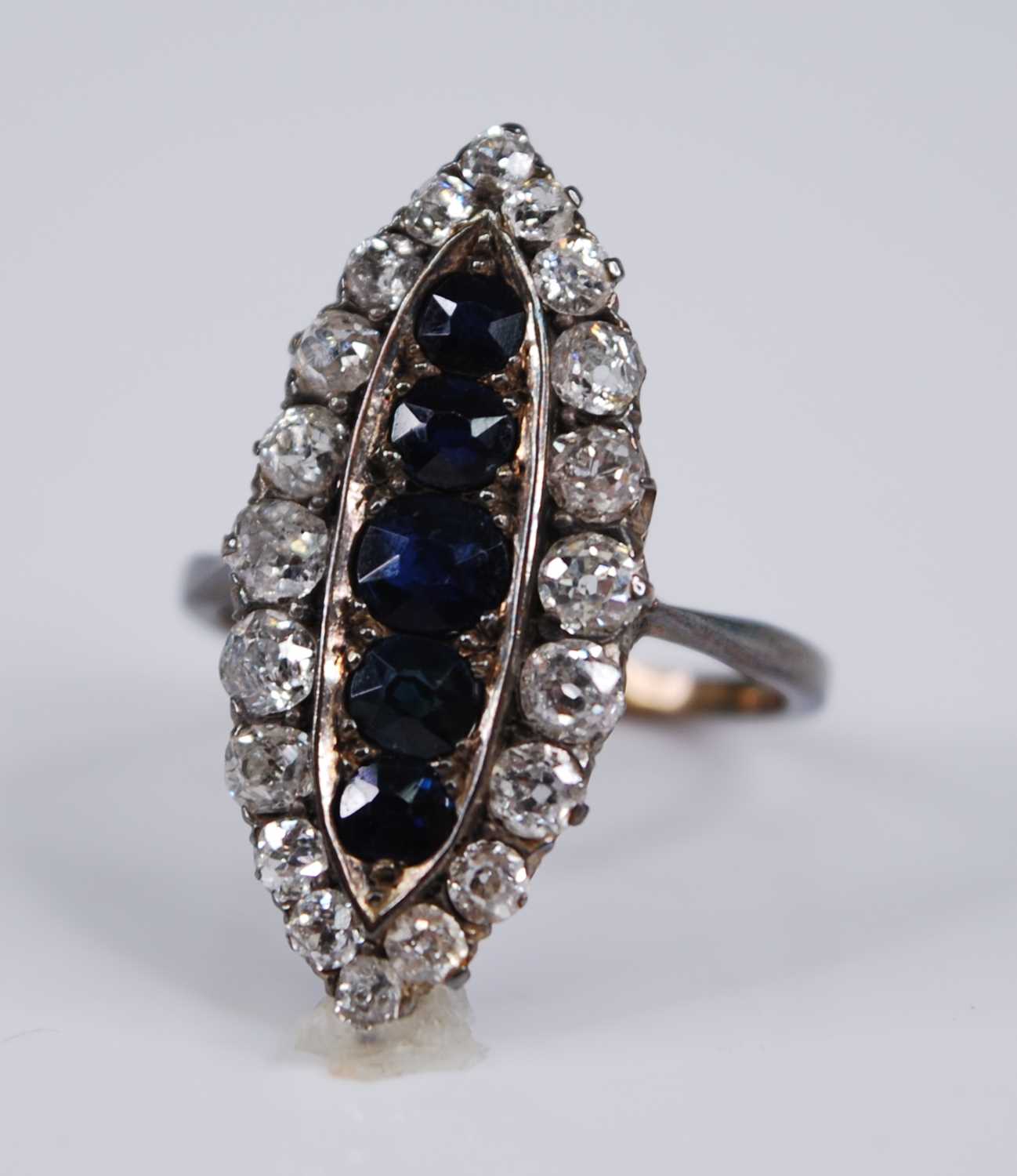 Lot 2187 - An Edwardian yellow metal, sapphire and...