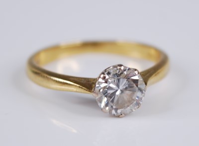 Lot 2296 - An 18ct gold diamond solitaire ring, the eight-...