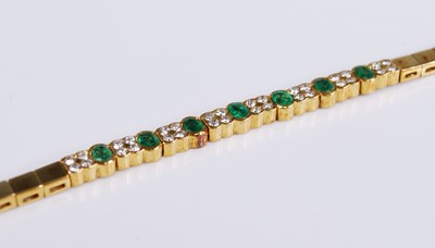 Lot 2302 - A contemporary yellow metal, emerald and...