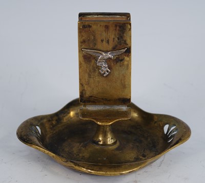 Lot 307 - A brass ashtray of shaped square form with...