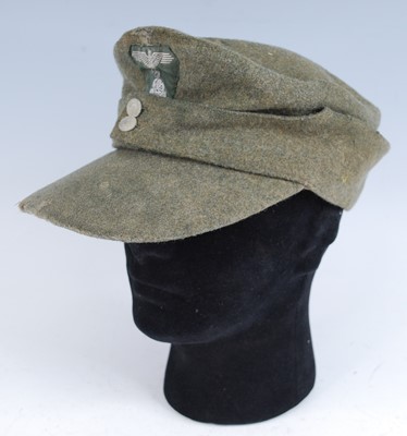 Lot 294 - A German M43 SS Field cap, in green wool with...