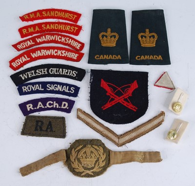 Lot 619 - A collection of military insignia, to include...