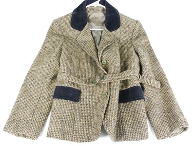 Lot 382 - A ladies hunting jacket in green and brown...