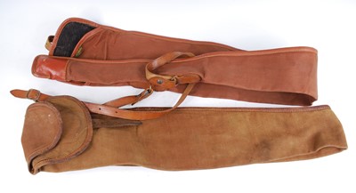 Lot 384 - A brown canvas gun slip with leather trim,...