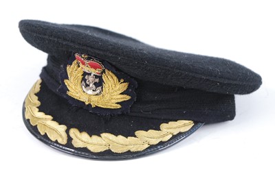 Lot 327 - A WW II Royal Navy Captains visor cap, in...