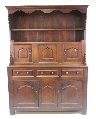 Lot 2584 - A George III joined oak dresser, the upper...