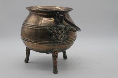 Lot 1 - A 17th century bronze tripod cauldron, having...
