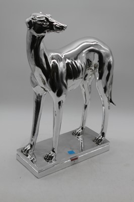 Lot 7 - A silver resin model of a greyhound, in...