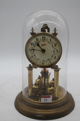 Lot 16 - A Schatz brass anniversary clock, housed under...